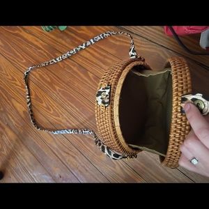 Handwoven round crossbody purse with cheetah strap